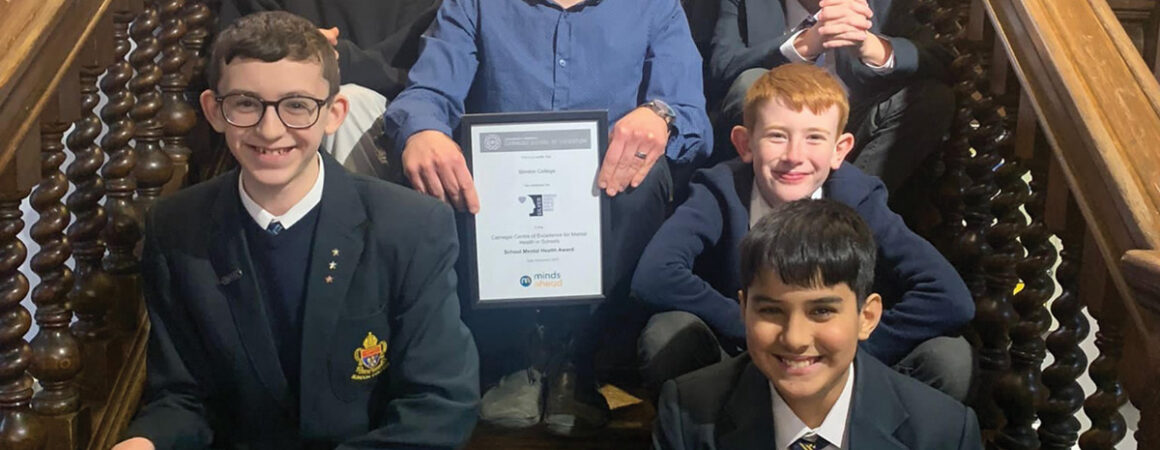 Slindon College SENCO Adam Sharpe and pupils with the Carnegie Schools Mental Health Award